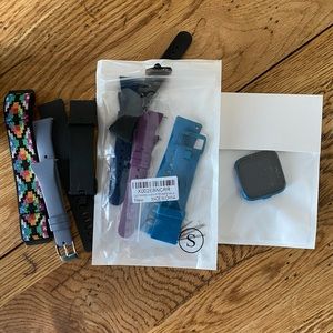 Fitbit versa lite (blue) with assortment of bands